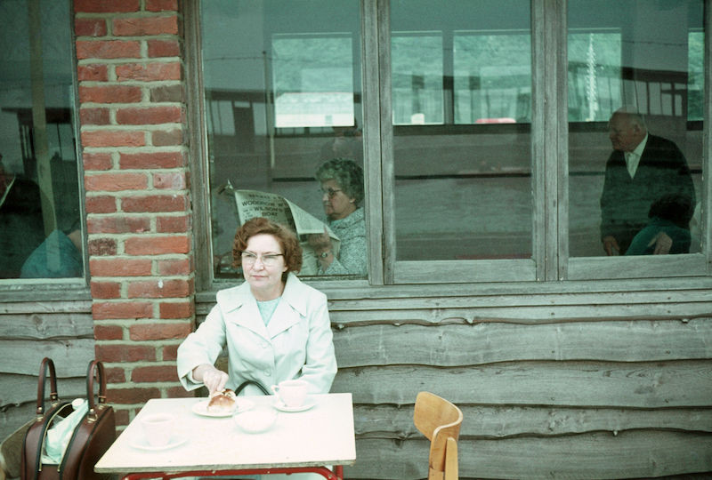 An early photograph of my mother with my reflection
seen just above the head of the woman inside.