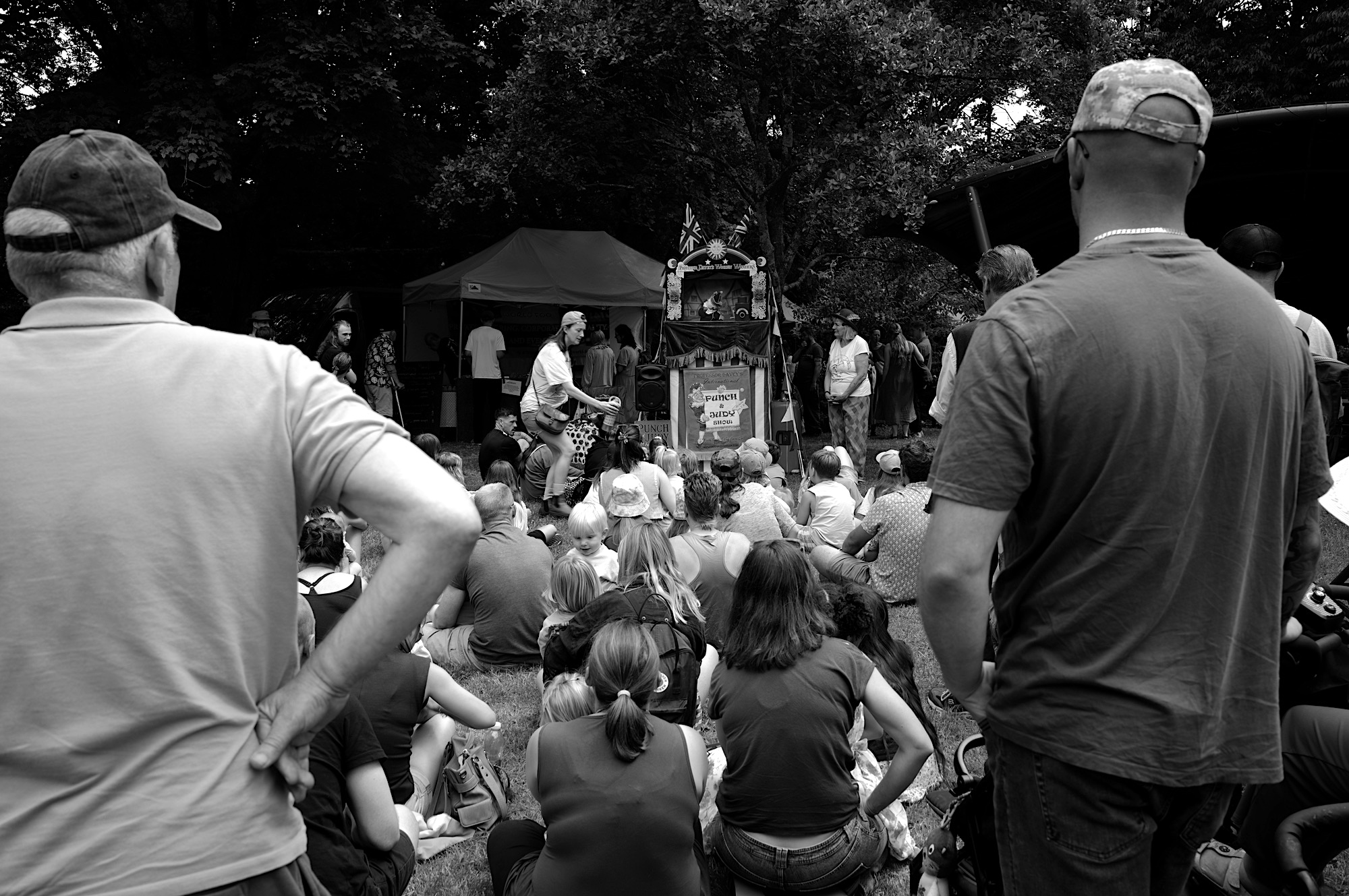 Children watching a Punch and Judy show.