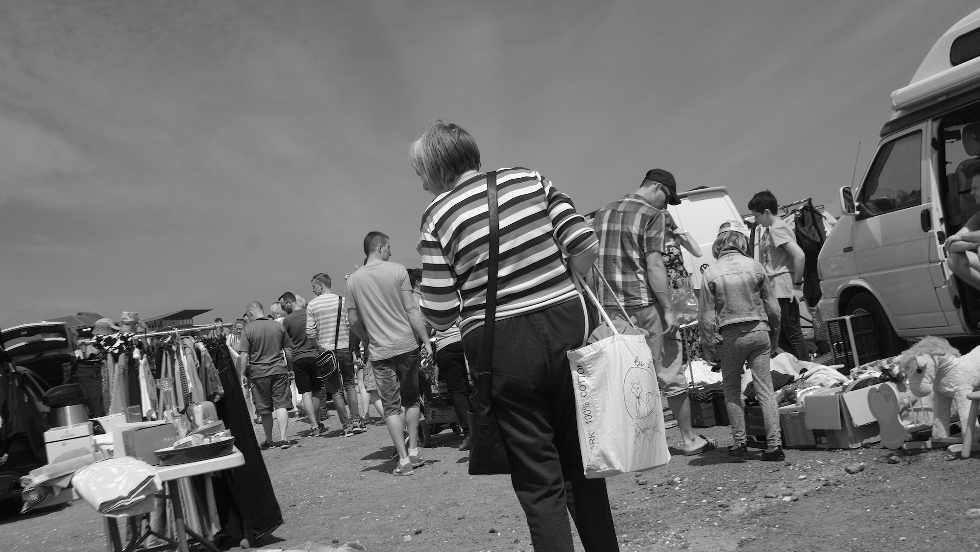 People looking at the things for sale.